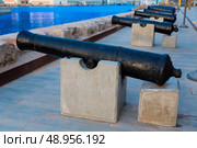 Cartagena cannon in naval museum with port at Murcia Spain. Стоковое фото, агентство Ingram Publishing / Фотобанк Лори