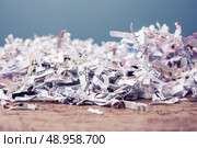 Paper cut into tiny pieces by cross shredder. Стоковое фото, агентство Ingram Publishing / Фотобанк Лори