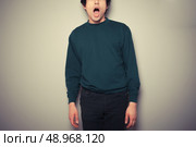 A young man is surprised and has his mouth open. Стоковое фото, агентство Ingram Publishing / Фотобанк Лори