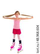 blond pigtails roller skate girl full length on white background. Стоковое фото, агентство Ingram Publishing / Фотобанк Лори