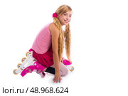 blond pigtails roller skate girl on her knees happy on white background. Стоковое фото, агентство Ingram Publishing / Фотобанк Лори