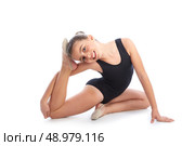 Kid girl rhythmic gymnastics exercises on white background. Стоковое фото, агентство Ingram Publishing / Фотобанк Лори