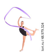 Kid girl ribbon rhythmic gymnastics exercise on white background. Стоковое фото, агентство Ingram Publishing / Фотобанк Лори