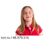 crossed eyes blond kid girl funny expression gesture in white background. Стоковое фото, агентство Ingram Publishing / Фотобанк Лори