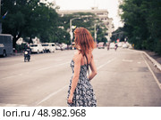A young caucasian woman is walking in Manila. Стоковое фото, агентство Ingram Publishing / Фотобанк Лори