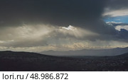 Moving sunbeams and mountain landscape. Стоковое видео, видеограф Михаил Коханчиков / Фотобанк Лори