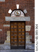 one of the door in the church of san babila in milan. Стоковое фото, агентство Ingram Publishing / Фотобанк Лори