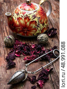 the teapot in the background of elite sorts of tea.the image is tinted in vintage style. Стоковое фото, агентство Ingram Publishing / Фотобанк Лори