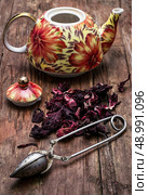 the teapot in the background of elite sorts of tea.the image is tinted in vintage style. Стоковое фото, агентство Ingram Publishing / Фотобанк Лори