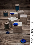 spool sewing thread and buttons in vintage style. Стоковое фото, агентство Ingram Publishing / Фотобанк Лори