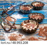 process of making coffee cupcakes. process of making coffee muffins on wooden countertop in rustic style.Photo tinted.Selective focus. Стоковое фото, агентство Ingram Publishing / Фотобанк Лори