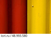 abstract colored red and yellow iron metal sheet in la boca buenos aires argentina. Стоковое фото, агентство Ingram Publishing / Фотобанк Лори