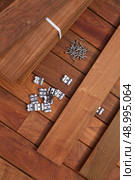 Ipe decking deck wood installation screws clips and fasteners. Стоковое фото, агентство Ingram Publishing / Фотобанк Лори