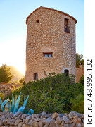 Javea Xabia el molins at sunset in Mediterranean Alicante at Spain. Стоковое фото, агентство Ingram Publishing / Фотобанк Лори