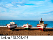 Almeria Cabo de Gata San Miguel beach boats in Spain. Стоковое фото, агентство Ingram Publishing / Фотобанк Лори