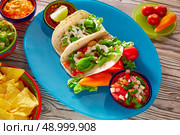 Fish tacos mexican food with guacamole nachos and chili pepper sauce. Стоковое фото, агентство Ingram Publishing / Фотобанк Лори
