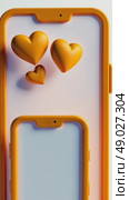 A modern 3D icon of a smartphone displaying Eid greetings with floating emoji hearts above it in children cartoon style. Стоковое AI-видео, аниматор Sergey Grishin / Фотобанк Лори