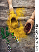 spicy food. Set of different spices on the old wooden table.Photo rustic. Стоковое фото, агентство Ingram Publishing / Фотобанк Лори