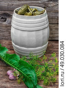 pickled cucumbers. Pickles in barrel of pickles in rustic style.Photo tinted. Стоковое фото, агентство Ingram Publishing / Фотобанк Лори