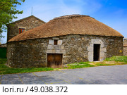 O Cebreiro by the way of Saint James in Galicia Palloza traditional celtic hut. Стоковое фото, агентство Ingram Publishing / Фотобанк Лори