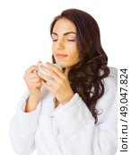 Young healthy girl with bathrobe and cup isolated. Стоковое фото, агентство Ingram Publishing / Фотобанк Лори