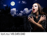Vampire girl on night sky with moon. Стоковое фото, агентство Ingram Publishing / Фотобанк Лори
