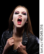 Young beautiful vampire woman on black. Стоковое фото, агентство Ingram Publishing / Фотобанк Лори
