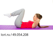 Sporty girl doing gymnastic exercises isolated. Стоковое фото, агентство Ingram Publishing / Фотобанк Лори