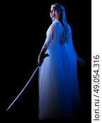Young elven girl with sword isolated. Стоковое фото, агентство Ingram Publishing / Фотобанк Лори