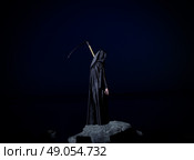 Woman with braid on rock. Стоковое фото, агентство Ingram Publishing / Фотобанк Лори