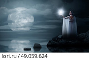 Young elven girl with star isolated on sea coast. Стоковое фото, агентство Ingram Publishing / Фотобанк Лори
