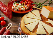 Tapas sausage mix from Spain jamon iberico lomo cheese ham chorizo olives. Стоковое фото, агентство Ingram Publishing / Фотобанк Лори