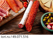 Tapas sausage mix from Spain jamon iberico lomo cheese ham chorizo olives. Стоковое фото, агентство Ingram Publishing / Фотобанк Лори