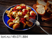 Tapas Patatas Bravas potatoe fries with tomato and mayonaise from Spain. Стоковое фото, агентство Ingram Publishing / Фотобанк Лори