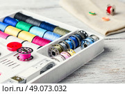 Beads,thread and bobbins for needlework.Picture in light key. Стоковое фото, агентство Ingram Publishing / Фотобанк Лори