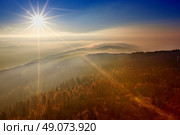 View on the sun over inversion from Jested, Jested-Kozakov ridge, Czech Republic. Стоковое фото, агентство Ingram Publishing / Фотобанк Лори