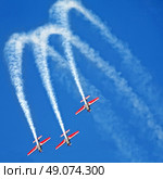 three airplanes Extra EA-300 on airshow. Стоковое фото, агентство Ingram Publishing / Фотобанк Лори