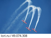three airplanes Extra EA-300 on airshow. Стоковое фото, агентство Ingram Publishing / Фотобанк Лори