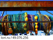 Trawler boat net rolled in its axis from Mediterranean port. Стоковое фото, агентство Ingram Publishing / Фотобанк Лори