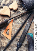 Symbolic wooden hearts cut by hand and carpenter tools. Set woodworking tool. Стоковое фото, агентство Ingram Publishing / Фотобанк Лори