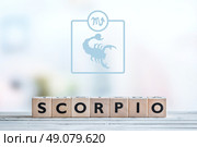 Scorpio star sign on a wooden table. Стоковое фото, агентство Ingram Publishing / Фотобанк Лори