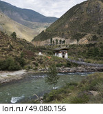 Suspension bridge over a river, Tachog Lhakhang Iron Chain Bridge, Paro, Paro District, Paro Valley, Bhutan. Стоковое фото, агентство Ingram Publishing / Фотобанк Лори