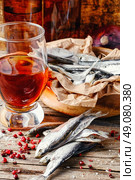 Glass of beer,smoked sprat,spices in traditional  rustic style. Стоковое фото, агентство Ingram Publishing / Фотобанк Лори