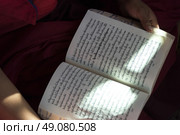 Close-up of a monk reading a book, Paro, Paro District, Paro Valley, Bhutan. Стоковое фото, агентство Ingram Publishing / Фотобанк Лори