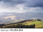 Rain, clouds and sunlight in spring hills. Стоковое фото, агентство Ingram Publishing / Фотобанк Лори