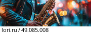 A close-up shot of a musician playing a saxophone on stage with a blurred background of colorful lights. Стоковое AI-изображение, AI-художник Данила Большаков / Фотобанк Лори
