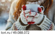 Gloved hands gently cradling a steaming cup of aromatic coffee outdoors. Warm cozy winter scene. Hot Mug of beverage in the wool mittens closeup. Warming drink at cold weather. Hike, camping concept. Стоковое AI-видео, аниматор Марина Демидюк / Фотобанк Лори