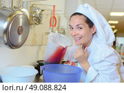woman in the preserved food factory. Стоковое фото, агентство Ingram Publishing / Фотобанк Лори