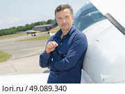 Portrait of man at airfield. Стоковое фото, агентство Ingram Publishing / Фотобанк Лори