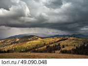 Spring rain in mountains. Thunder and clouds. Стоковое фото, агентство Ingram Publishing / Фотобанк Лори